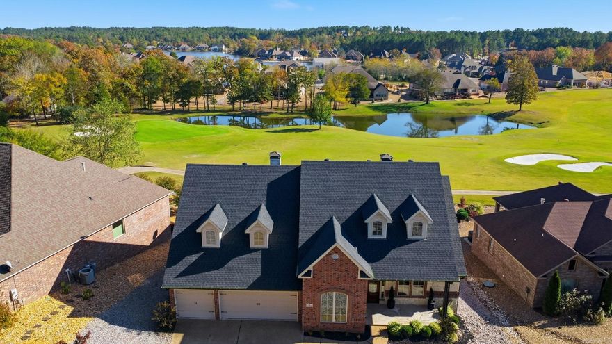 Welcome to 24 Algeciras Lane, where golf course living meets timeless comfort. Perfectly positioned with a view of the 8th green on Isabella Santa Maria Golf Course, this beautifully designed three-bedroom, three-bath home offers sweeping fairway to green views through expansive windows that flood the main living areas with natural light. Inside, you’ll find elegant details throughout — a formal dining room, an office with a coffered ceiling, and two cozy fireplaces that make the home feel warm and inviting. The kitchen features a gas cooktop, generous workspace, and a layout designed for both everyday living and entertaining.  The spacious primary suite is a true retreat, with a spa-like bath that includes a jetted tub, walk-in shower, and a custom closet with built-in dresser. A large floored attic provides excellent storage, and the oversized three-car garage adds convenience and functionality.  Enjoy golf course views, refined finishes, and plenty of space to relax or host — this is the perfect place to call home in Hot Springs Village.