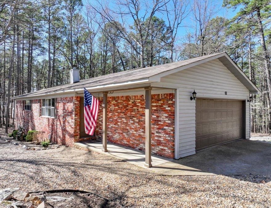 CHARMING CORNER-LOT HOME WITH SERENE WOODED VIEWS  This inviting 3-bed, 2-bath home is nestled on a peaceful corner lot, offering a quiet setting with beautiful wooded views. Located in Hot Springs Village and just minutes from the Coronado Center, Woodlands Auditorium, POA, hiking trails, golf courses, pickleball/tennis courts, and lakes.  The open, flowing floor plan is perfect for entertaining! The dining area opens to a spacious deck, ideal for upcoming summer barbecues.  Enjoy cozy evenings by the wood-burning fireplace in the living room.  The spacious master suite features a walk-in shower, while the well-equipped kitchen offers a breakfast bar and ample storage.  Relax on the back deck, where you’ll enjoy uninterrupted views of nature—no neighboring houses directly behind or next door.  Additional highlights: • 2 car attached garage • Level lot in a quiet cul-de-sac • Prime location - just 30 minutes to Downtown Hot Springs, Bathhouse Row, shopping, restaurants, and more!   Whether you're looking for a full-time residence or a vacation retreat, this home offers comfort, privacy, and convenience. COME AND SEE!   Agents - please schedule all showings with Showing Service.