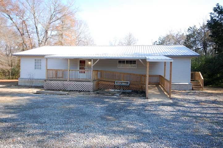 Recently remodeled this home has new metal roof, subflooring, tile, Bella Chestnut laminate flooring, trim, siding, lighting, paint, two new decks, and window treatments. This home is handicapped Accessible and has wheel-in shower, ramp, counter, and doorways. This split floor plan has full four bedroom two bath and is close to shopping and I 40. This property includes two lots which are already subdivided for a potential future sale or growth.