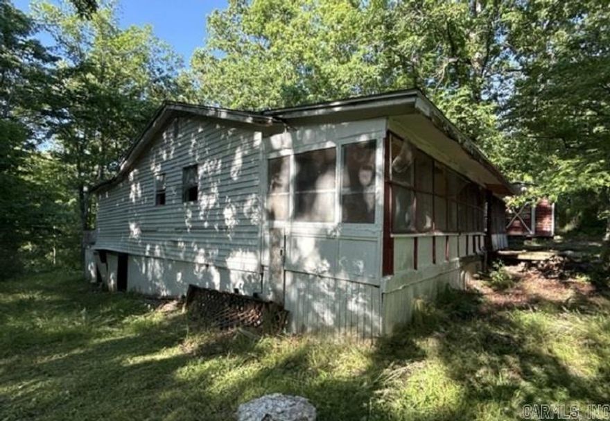 Located in Ozark Acres, this 1 acre m/l property offers strong potential for investors, builders, or anyone seeking a project site. The home has been cleaned inside and out, providing clear access for evaluation and planning. The setting includes a view of the nearby lake and room for a new build, remodel, or rental opportunity in a quiet, wooded community. A solid option for those looking for a value-add project with flexibility.