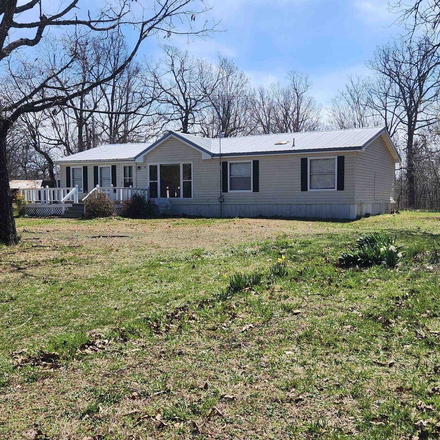 Come see this beautiful Manufactured home with 4 bedrooms and 2 baths in the country. Sitting on 5+/- acres of mostly wooded land in Beautiful Northern Sharp County. Circle driveway, water well. Front and back decks.  Several updates have been done but there is still a little left to do yet. So go pick out your flooring and pick out your favorite paint colors to finish this home out and make it your own. Sellers are offering a $2500.00 credit towards your flooring and paint. Make an appointment to see this one soon. This is just what everyone is looking for... a little place out in the country.