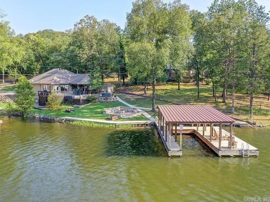 Public Auction Friday, October 9th at 11AM Contact Fowler Auctioneers for more information.   Beautiful waterfront luxury home with half-acre and 172' of waterfrontage, guest house, covered boat dock .   Visit www.fowlerauctioneers.com for further details.