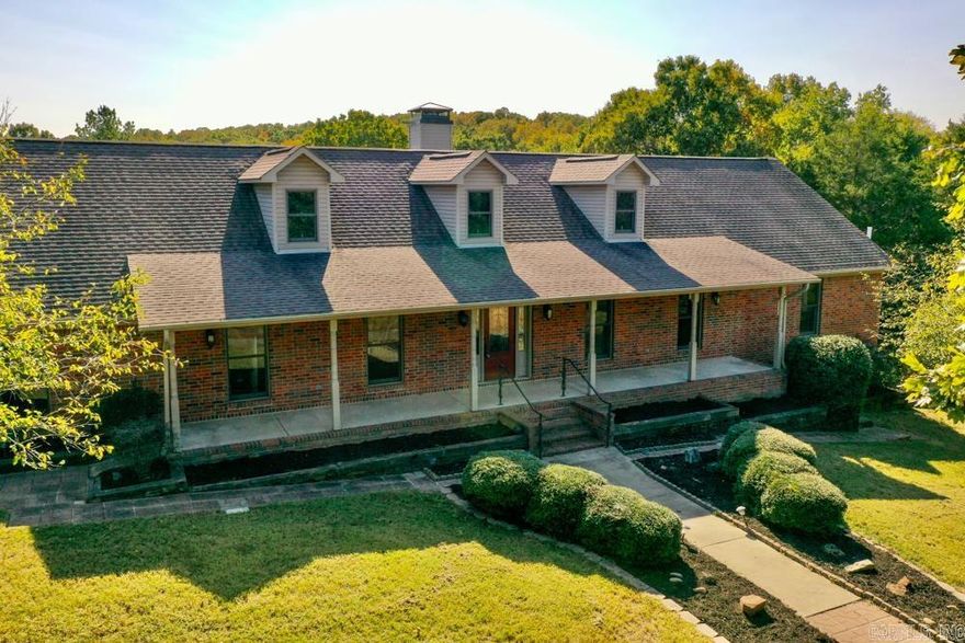 Welcome to your dream retreat! This exceptional custom-built home spans 4,826 +/- square feet and is perfectly situated on 70 +/- breathtaking acres, offering the ideal blend of luxury and nature. With 4 spacious bedrooms and 3.5 bathrooms, this home features an inviting open floor plan that seamlessly connects the living, dining, and kitchen areas, perfect for entertaining and family gatherings.  The main floor boasts three well-appointed bedrooms, including a luxurious master suite, ensuring comfort and convenience. The heart of the home is the expansive kitchen, showcasing beautiful maple cabinets and ample counter space for all your culinary adventures. The large walk-out basement adds even more value with full living quarters, providing flexibility for guests or potential rental income.  Step outside to discover your own private oasis. The property includes a stocked pond, ideal for fishing and relaxation, surrounded by diverse timber comprising majestic oak ridges, towering pine forests, and serene cedar groves. Wildlife enthusiasts will appreciate the abundant deer and turkey, making this an ideal setting for nature lovers and outdoor adventurers alike.