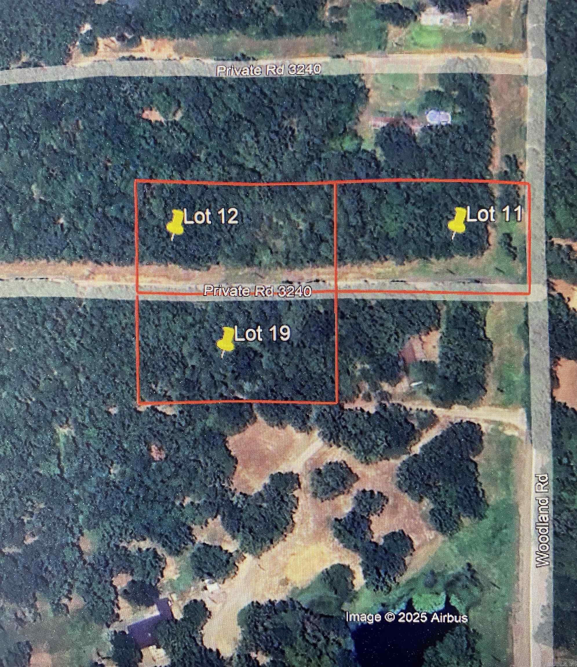 Tucked away in the peaceful Woodland community, this 1-acre wooded lot offers a secluded, natural setting with everything you need to get started. Enjoy Private Road access, electricity on site, and water available at the pavement. The land is level at the road and gently declines toward the back, creating an ideal build site surrounded by mature shade trees. A meandering wet-weather stream adds charm and natural interest to the property—perfect for those who appreciate a scenic, quiet retreat. This is 1 of 3 available lots—purchase one, two, or all three for even more space and opportunity.