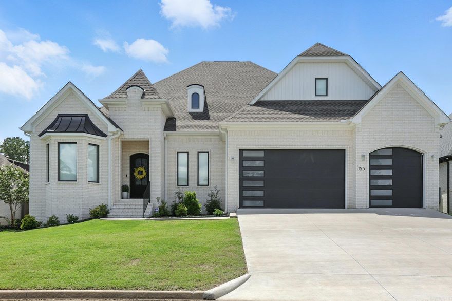 153 Caurel Circle, nestled in a serene and secure neighborhood, just a stone's throw from Little Rock Christian School. This exceptional property offers the perfect blend of tranquility and convenience, with minimal traffic and easy access to everything you need, including Walmart and a community pool within walking distance!  The beautiful hardwood and travertine floors flows throughout the home. The heart of this house is undoubtedly the kitchen, boasting a magnificent double island – perfect for entertaining or enjoying casual family meals. You'll find ample storage solutions throughout, making organization a breeze.  The main level is thoughtfully designed for ultimate comfort and accessibility, featuring a luxurious primary bedroom suite, a dedicated office space, and a convenient half bath. Prepare to be amazed by the oversized primary bedroom, complete with a grand walk-in closet that is truly a "girl's dream"! This home is also incredibly kid-friendly, designed with families in mind.  The tankless water heater, ensures you'll never run out of hot water!– a truly unbeatable perk!  This home offers everything you could desire and more