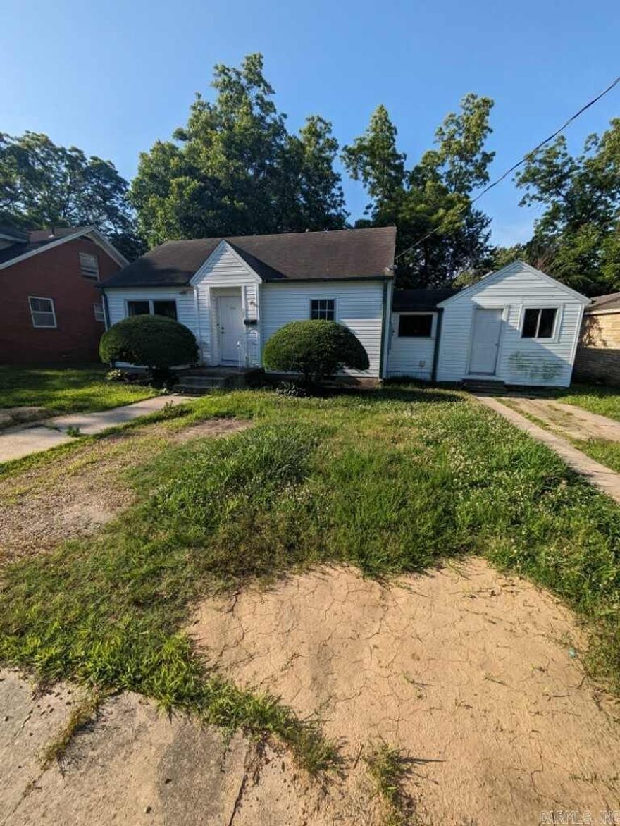 Great home for investor, a renovation project or a starter home for someone willing to do a little work.  This home has three bedrooms and one bath.  It is in a neighborhood that has seen a number of houses renovated and is in the very center of Jonesboro, close to everything.  The home sits on a large lot with two different access points for vehicles.  With a little loving care, this home could be a nice, cozy cottage.