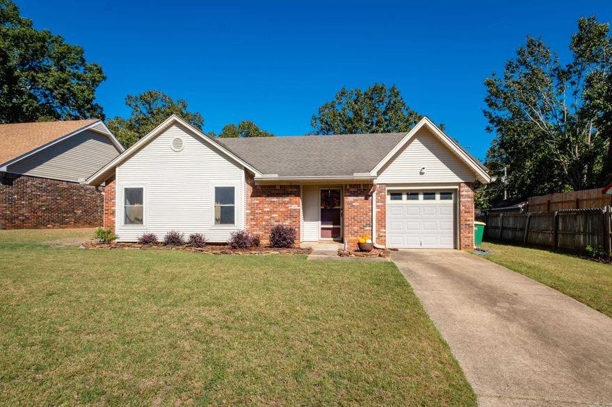 Amazing one level 3bed/2bath with new LVP flooring throughout with a garage! Huge fully fenced backyard with extensive landscaping including flagstone patio and beautiful firepit!