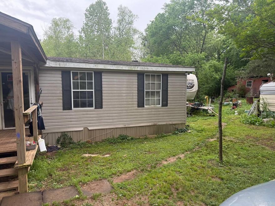Well-kept 4BR/2BA double-wide manufactured home on 1.39Â± acres in Royal. Features spacious living areas, split-bedroom layout, walk-in closets, covered porch, covered parking, metal roof, and peaceful rural surroundings near Hot Springs.