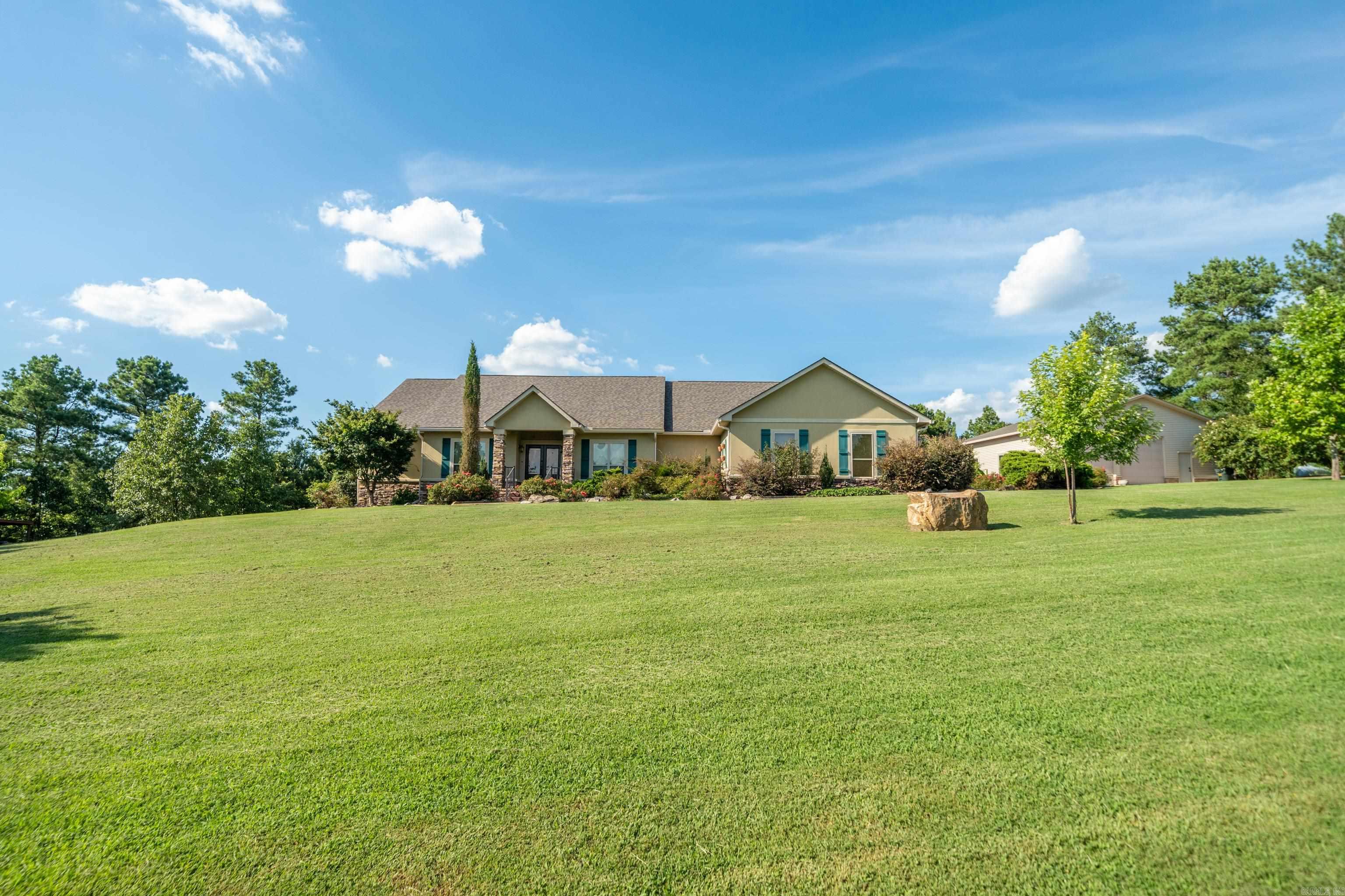 This stunning 5-bedroom, 3.5-bath home offers a rare opportunity to enjoy rural living with all the amenities you could wantāand then some! Take a dip in your private in-ground pool, relax in the cabana with its own half bath, or get creative in the spacious detached garage/workshop. Need room for your boat, tools, or equipment? A metal carport has you covered. For green thumbs or aspiring homesteaders, the property also includes a greenhouse, metal barn, and two chicken coops. Inside, the wood floors and soaring vaulted ceilings welcome you into a light-filled great room, seamlessly connected to a chef-inspired kitchen with double convection ovens, gas range with pot filler, hammered copper sink, & built-in ice maker. A cozy gas-log fireplace and built-in shelving add the perfect finishing touch. The luxurious primary suite features a spa-like bath and oversized walk-in closet, and with five bedrooms total, thereās flexibility for a home office, guest rooms, or hobby spaces. Bonus features like a safe room, oversized 2-car garage with extra storage and brand-new roofs (June) make this home even more exceptional. This is more than a houseāitās a lifestyle. Come see for yourself