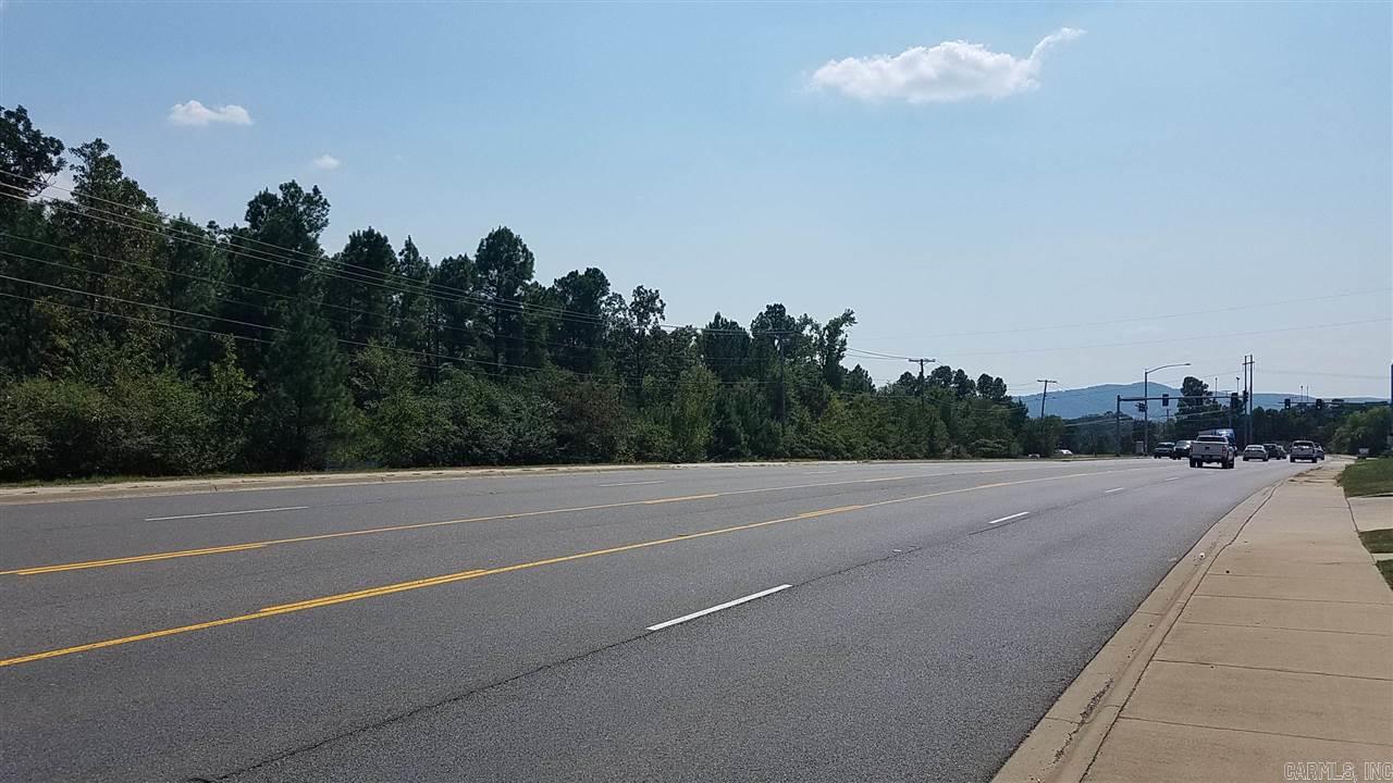 11.56 acres of Prime Development property Zoned C-4 Commercial with all city utilities. High daily traffic counts along a 5 lane road, located at a stop light intersection, in an area of current growth. Additional adjacent acreage is available. One of the owners is a licensed Arkansas Real Estate Agent.