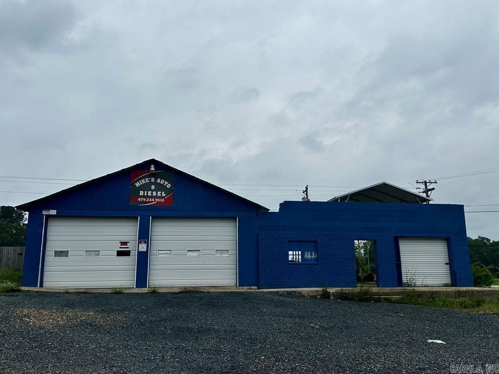 INVESTMENT OPPURTUNITY! Can be bought as a whole or subdivided. Approximately 1.2 acres of PRIME highway frontage with a spacious office building, mechanic shop that includes a lift, snow cone stand with seating and storage (some supplies are left including an ice shaver), and a lot that could be residential or commercial. There are 4 septic systems on the property (snow cone stand has a new one). City water on the properties. There is a 30 ft carport and a 35 ft carport that is included. Mobile home is NOT included and will be moved prior to closing. All debris will be removed prior to closing unless buyer wants to keep any. MOTIVATED SELLER! Check it out.