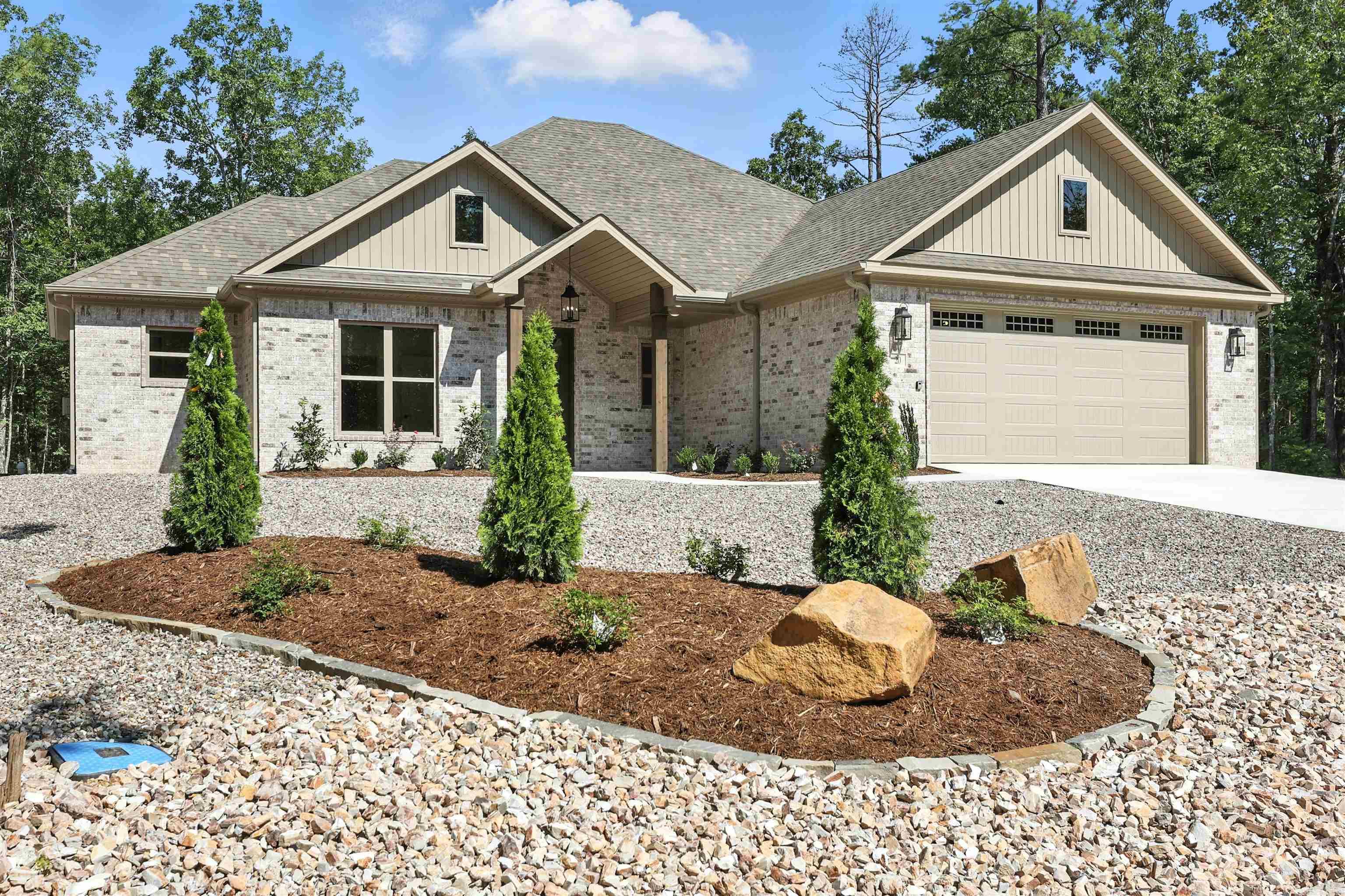 Elegant Easy Living in Hot Springs Village, this gorgeous all-brick new construction home offers 4 bedrooms, 2.5 baths, and a lifestyle of comfort and convenience. Natural light pours through bright, expansive windows, illuminating a spacious open floor plan anchored by a cozy fireplace. The kitchen features a sleek gas cooktop, a pantry to die for, and 2 ovens perfect for everyday cooking or entertaining. Outside, low-maintenance landscaping enhances curb appeal without the upkeep. This home is as livable as it is lovely, call for your appointment!