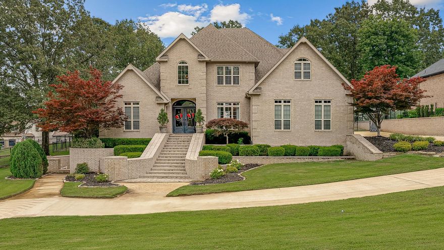 Step into timeless elegance with this expansive three-level home overlooking Ridgepointe's #3 tee box. With over 4,500 square feet of living space, this home offers a main level ensuite and 3 more bedrooms upstairs, each with access to a private or nearby bath, and a safe room with bathroom inside the finished basement. The main-level primary suite provides tranquil golf course views, soaring ceilings, a spa-inspired bath with steam shower, and two impressive his and hers walk-in closets. The kitchen is the heart of the home, featuring warm wood cabinetry, a gas cooktop with pot filler, double wall ovens, and a center island, and generous pantry storage. Just off the kitchen, the casual living area invites conversation, while the breakfast room with built-ins offers space for laid-back meals. A show-stopping two-story great room showcases floor-to-ceiling windows framing the golf course beyond, complete with a cozy gas fireplace and custom built-ins. Upstairs, you'll find a bonus room perfect for a playroom, media space, or second living area.