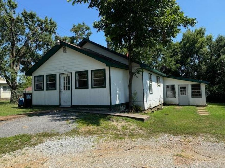 OLDER 3BR, 2BA HOME 1/4 ACRE!  This 1448 square foot older home would make a great rental property! Has 3 bedrooms and 2 bathrooms. Living room with ornamental fireplace, dining room, kitchen with bar, laundry room and storage room. Original hardwood floors. Central heat and air unit not in use. Sits on a .26 lot. City utilities. Home will not qualify for a government loan and is being sold “As Is”.