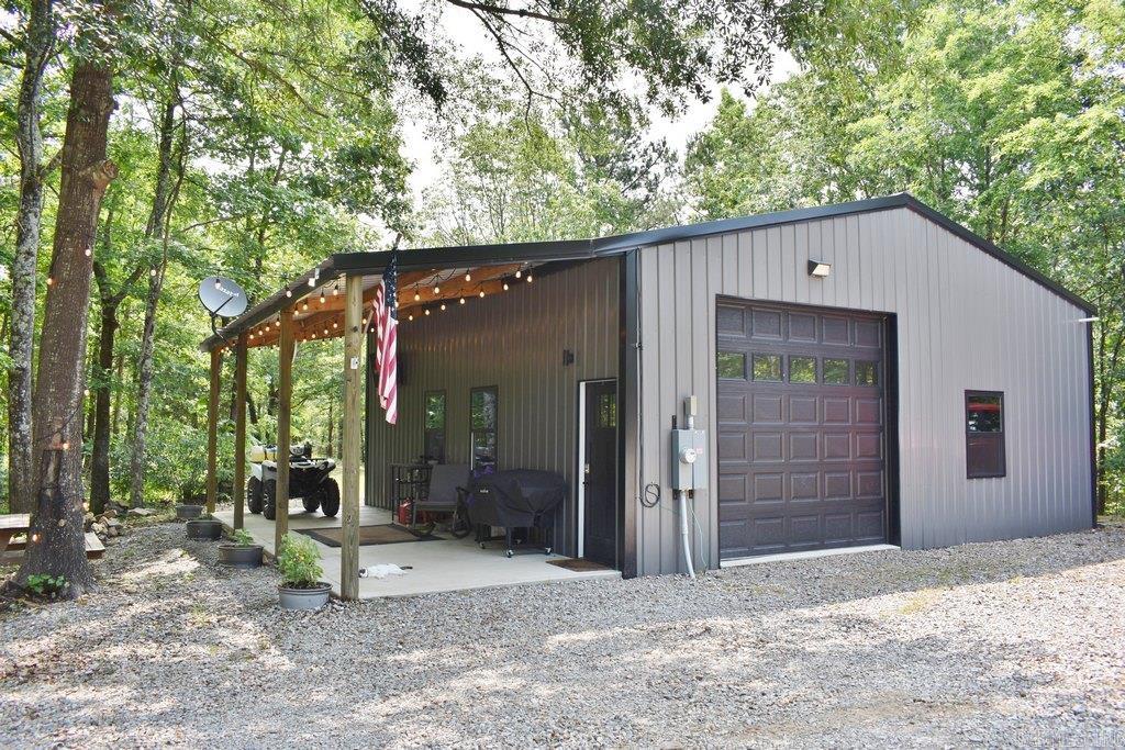 Getaway Paradise for you to absorb the tranquil power of nature. This newly built "Bandominium" home is nestled on 5 acres of private wooded land and yet conveniently located only 20+ mins from Hot Springs and I-30 to Benton. It features a combination of Rustic Country Charm exterior and a contemporary designed open floor open floor plan on the inside. Airy living area with high ceiling and convenient open kitchen is just perfect for an easy, cozy and simple style of living. Spacious covered patio is an ideal spot for your outdoor living or gathering with friends and family. Come to see this lovely property and get a feel of the beautiful and peaceful moment of nature.