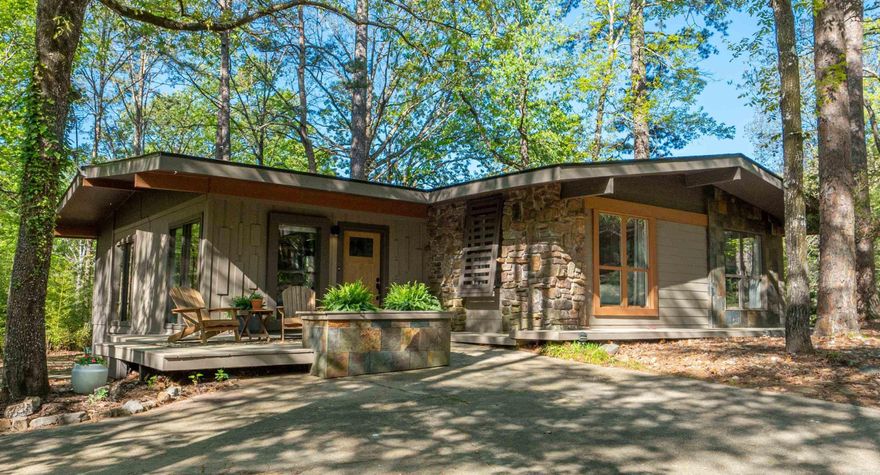 Nestled on a picturesque tree-lined street in the heart of Hot Springs Village, this 1552 sq. ft. home offers fantastic updating and is move-in ready. Built in 1975, this house could easily become a fabulous place to call home or a weekend get-away vacation home that is a short golf cart ride from DeSoto Golf Course. Featuring a spacious layout, this home includes multiple living areas and a generously sized yard perfect for outdoor activities. The tranquil surroundings and mature trees add to the charm and privacy of this property. Enjoy the best of both worlds with peaceful living while being close to local amenities and recreational facilities. New roof in 2024 and new tankless water heater. Buyers subject to $2000.00 buy-in fee.