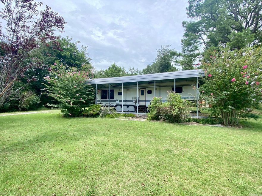 1/2 acre corner lot with a beautiful view of the mountains. Property has an RV and RV Cover that will convey with the land