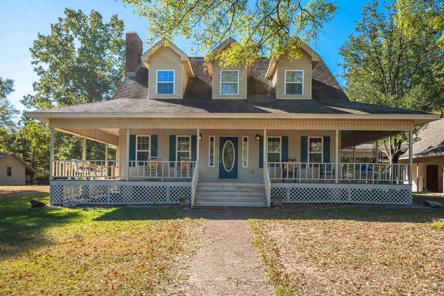 This stunning 4-bedroom, 2.5-bathroom home, built by local craftsman Max Stroud, offers over 3,700 sq. ft. of living space just 3 miles from town, with numerous updates throughout.The home features two spacious living areas, each with its own fireplace, and beautiful hardwood floors throughout, creating a warm, inviting atmosphere. A private office above the carport offers a peaceful work-from-home space with inspiring views. Outdoors, enjoy a fenced-in pool with a new liner and pump, plus a pool house with a bathroom. The property also boasts a charming wrap-around porch, ample parking with a circular driveway, and a secluded lot bordered by woods for ultimate privacy. Meticulously cared for by only two owners, this home blends elegance with comfort—don’t miss your chance to own this exceptional property.  Interior pictures coming soon!