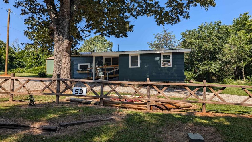 NEW PRICE!! CURB APPEAL! One level home with lots of space. 2 bedrooms plus two more spaces, one currently used as den and the other as a dining room; plenty of space for entertaining or use it as your home office. Open living and kitchen area. New stainless steel fridge, dishwasher and stove stay with the home. Custom cabinets, wood walls and ceilings. Updated flooring and freshly painted walls. Metal roof, vinyl/metal siding, city sewer and water. Propane tank is owned and stays with the property. 2 level lots with circle drive, shed and small fence for pets. Rear patio and ramp into front for easy access into the home. Located close to schools and groceries. Only 1.5 mi to Highland Park playground and boat ramp to Lake Mirandy. Well maintained home and property is move in ready! Last years taxes less than $300 or little to no real estate taxes with the homestead credit if this becomes your primary residence!