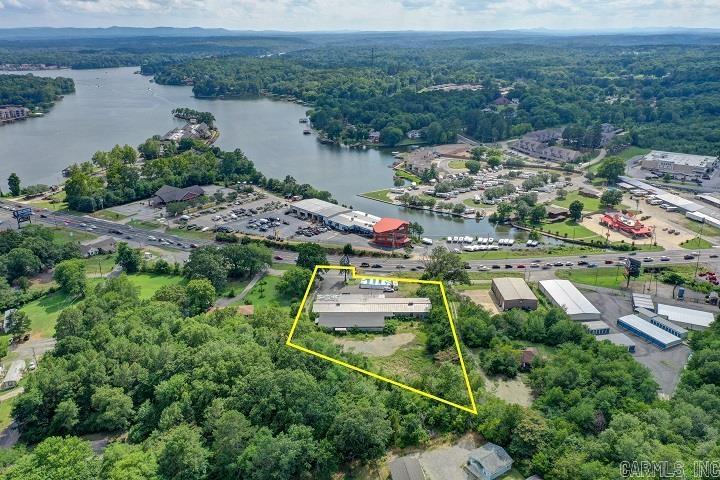 Property is ripe & ready for development--Huge Commercial Potential!! Approximately 2 acres and 190 feet of Albert Pike Road Frontage. Excellent access and visibility. Daily traffic count of 34,000 cars per day. All utilities available. Across the street from Lake Hamilton. Value is in the land.