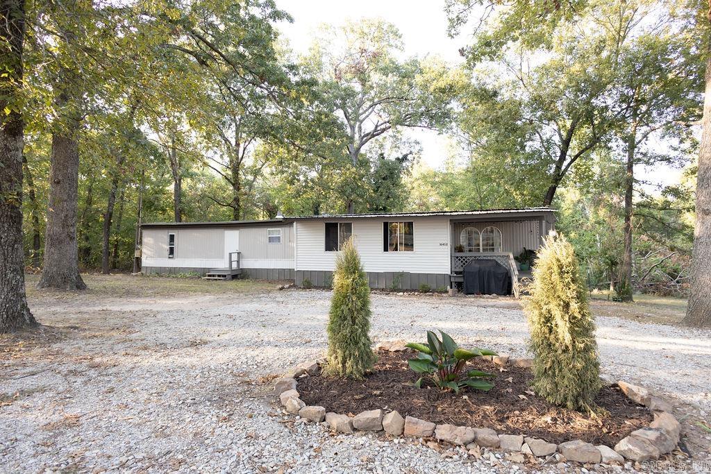 Absolutely charming 2/1.5 nestled on .7 acres less than 5 minutes from the lake OR river!!! This home is IMMACULATE! Relaxation and comfort beckon you as you step on the porch that is perfect for star gazing. The kitchen has a beautiful cedar and stainless workstation and the den has a built-in and plenty of windows. Newer laminate floor throughout, freshly painted, tucked away on a beautiful lot, and only 15 minutes to MH Walmart. North Fork River access less than 2 miles and Norfork Lake access within 3 miles! Come see this delightful home! You wonāt want to leave!