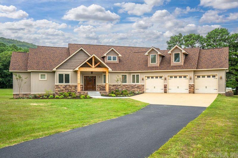 Breathtaking, large 2 story home, nestled at the bottom of Mt. Riante located in Lakeside School District! This beautiful property boasts a 3,955 square foot home on 3 acres. As you approach you will enjoy the beautiful views of Mt. Riante, as well as professional landscaping at the front of the home! Step inside this exquisite home and be greeted by an inviting open-concept living space. Built-ins and granite countertops throughout the kitchen are complemented by an elegant glass top stove, large oven, a warming drawer, and a raised dishwasher! The large island is perfect for family or friend gatherings! The large pantry provides ample storage. The living room offers a comfortable place for family time, as well as huge windows overlooking the backyard giving the opportunity to watch the abundance of wildlife that frequent the property. The oversized master bedroom suite connects to a large master bathroom with a walk-in shower, jacuzzi tub, and a large walk-in closet! The downstairs also includes an office area with a built-in desk and bookshelves, large utility room, and a mud room just off of the garage entrance with built-in lockers!