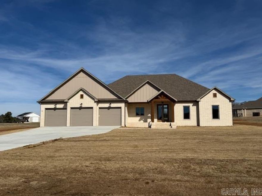 Nice 1.33 acre lot!!The sunsets from the front porch are beautiful! The living room is large with an impressive tile wood look fireplace and vaulted ceiling. The kitchen has abundant cabinetry and a large pantry hidden behind the cabinet doors. The amount of storage in the kitchen is amazing. The primary bedroom is spacious. Double vanities in the primary bath with a private powder room. The closet is just huge! And the laundry room has a sink with still more storage. Guest bedrooms are separate from the primary bedroom. You will appreciate the vaulted ceiling with large windows in the living room and dining room that let in so much natural light. Porches on both the front and the back. Beautiful home and beautiful views here!!