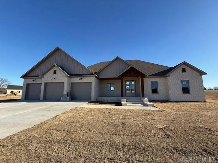 Nice 1.33 acre lot!!The sunsets from the front porch are beautiful! The living room is large with an impressive tile wood look fireplace and vaulted ceiling. The kitchen has abundant cabinetry and a large pantry hidden behind the cabinet doors. The amount of storage in the kitchen is amazing. The primary bedroom is spacious. Double vanities in the primary bath with a private powder room. The closet is just huge! And the laundry room has a sink with still more storage. Guest bedrooms are separate from the primary bedroom. You will appreciate the vaulted ceiling with large windows in the living room and dining room that let in so much natural light. Porches on both the front and the back. Beautiful home and beautiful views here!!