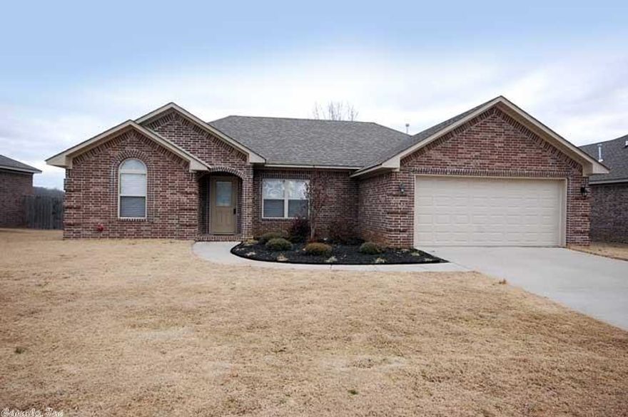 Gorgeous home close to the LRAFB!  All brick home w/ 3bedrooms/2baths split bedroom floor plan.  Large living room with open living/dinning combo floor plan, fireplace detailed with glass tiles.  Beautiful kitchen with wood stained cabinets, granite counter tops, travertine & glass tile back splash, large island with breakfast bar, stainless appliances.  Large bedrooms.  Master bedroom has trey ceiling bath features double sinks, jetted tub and shower, large closet.  Fully fenced back yard with nice deck!