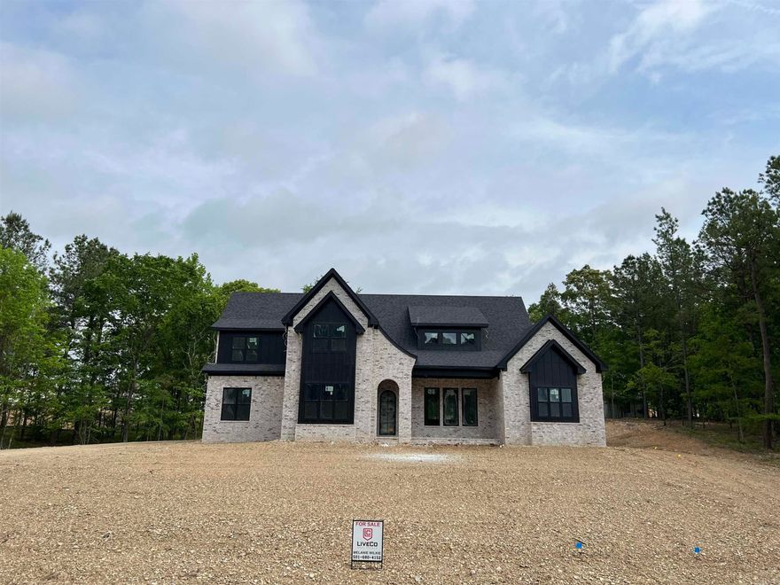 Discover tranquility in the esteemed Westridge subdivision, nestled in a one-way in, one-way out neighborhood. This new construction home is nestled on 2 acres, offering a spacious 4,100 sqft layout perfect for entertaining or kicking back with the family. Step inside and fall in love with the blend of French country style and modern comforts. The heart of the home, a chef's kitchen adorned with exquisite quartz countertops and a convenient walk-in pantry, is just waiting for you to create all the culinary delights. Enjoy seamless indoor-outdoor living with a covered back porch, perfect for al fresco dining or simply unwinding amidst the serenity of nature. The spacious master suite, is just one of five bedrooms, each offering unparalleled comfort and privacy. Need a space to work or unwind? Discover the versatility of the dedicated office and bonus room, providing endless possibilities for creativity, entertainment, or relaxation. With a three-car garage ensuring ample storage and parking, every detail of this home has been meticulously crafted to elevate your lifestyle. Don't miss the opportunity to experience refined living in Westridge – schedule your private tour today.