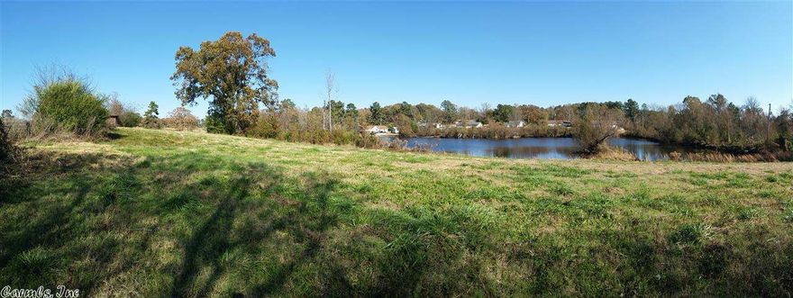 15 Beautiful Acres in a nice area, good school district and minutes from the Interstate!  Pasture land with a 2.5 Acre Pond, great for fishing and enjoying the country side.. There is also a 1/2 acre pond, structurally sound Barn with Loft (only needs a little repair), two home sites with two septics and utilities for both, & concrete driveway/parking.  Owner is selling land and improvements As Is.  Double and Single wide mobile homes add no value and are free with the purchase! See Aerial Photo