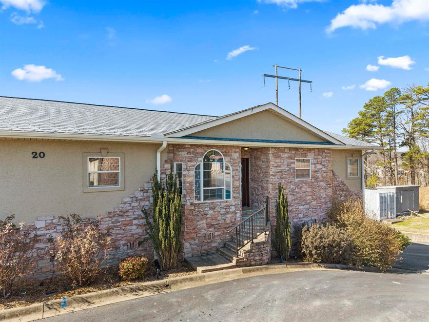 Discover easy living in this gated 3-bed, 2.5-bath condo on Lake Hamilton! The unique tri-level floor-plan offers top-level entrance with a private primary suite and laundry for convenience. The middle level features two guest rooms, a full bath, and a private balcony. The ground floor includes a 2-car garage with an attached bonus room---perfect for a creative studio, workshop, or game room. Enjoy access to the community pool in this secure, low-maintenance retreat.