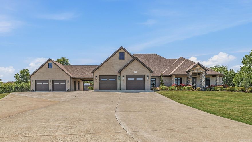 Custom luxury home with modern touches on 4.47 acres of land, Welcome to this stunning custom built residence at 4208 West Kingshighway in Paragould offering over 3400 square feet of thoughtfully designed living space on a beautifully landscaped, tree lined land. This all brick home features a desirable split bedroom floor plan with three spacious bedrooms, each offering private ensuite baths and generous walk in closets for comfort and privacy. The inviting foyer opens into an elegant formal dining room and an expansive great room designed for entertaining and everyday living. A bright sunroom and relaxing screened porch overlook the lush outdoor setting and create additional spaces to unwind year round. The custom details and upgrades throughout reflect quality craftsmanship and timeless style. A safe room adds peace of mind while the attached shop offers exceptional versatility for hobbies, storage, or workspace needs. The porte cochere and charming breezeway beautifully connect the home and shop while adding character and functionality to the property. Rarely does a property combine this level of custom design, space, and setting all within the city limits.