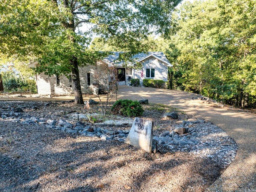 AGENTS SEE REMARKS! Beautiful 3 bedroom (split), 2 bathroom, with circle drive has a seasonal mountain/lake view. Gorgeous Arkansas Room off the Primary Bedroom with electric fireplace 2024. And it doesn't end there!! Another (H & C) 459 sq. ft. on lower level that would make a great media room, craft/hobby room or workshop. HVAC 2019, Roof 2021, Leaf Filter 2019, Water Heater 2020, Storm Door 2020, Primary Bath remodel 2021, Bathrooms Flooring 2021, LVP Flooring in living/dining 2021, Kitchen Island 2021, composite decking 2021, Fridge 2022, Stove 2021, added insulation over garage 2022, Garage Heater 2020, Simpli Safe 2021, 4 (4 ft.) LED lights added in crawl space. MOVE IN READY!!!!!