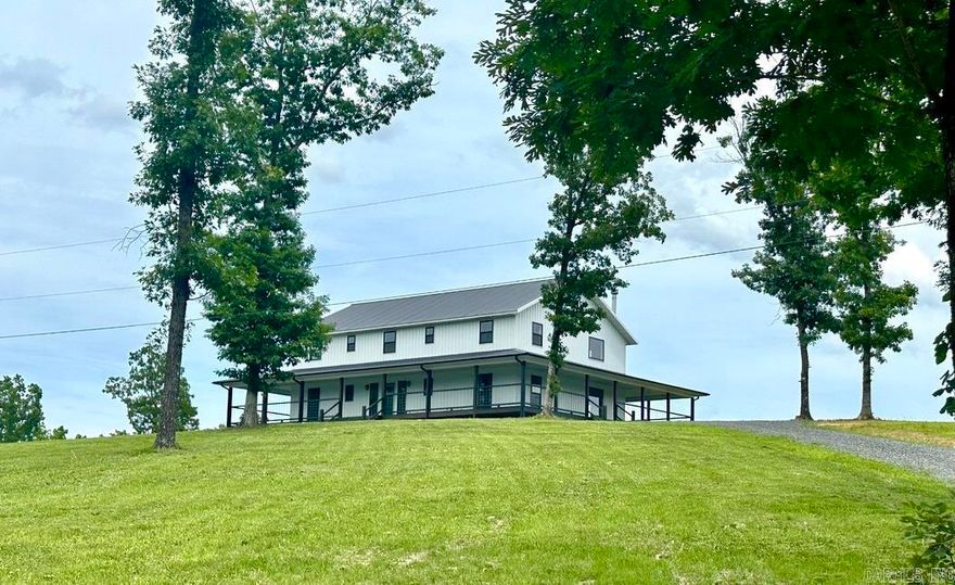 OZARK MOUNTAIN PARADISE with a breathtaking view of the Little Red River! This 4 bedroom, 3 bathroom home with a wrap around porch was built in 2021 & sits on 111.75 private acres with the most remarkable view! The home features an open floor plan with large windows in the main areas, a native stone woodburning fireplace, custom kitchen cabinets, stainless appliances, large island, and lots of storage/pantry space! The master suite has a spacious bedroom leading out onto the porch, full bathroom offering his/her sinks, walk in tile shower, claw foot soaking tub, and large walk in closet with custom built in shelving! Upstairs is 2 bedrooms, full bathroom, and a bonus room that would make a great office, craft room, or 5th bedroom! The home is very private but easily accessible! The property offers excellent hunting opportunities with NO RESTRICTIONS & FIBER INTERNET! This property would make an excellent getaway, Airbnb, or forever home!