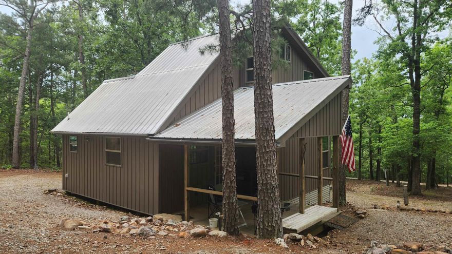 10 acres joining Ouachita National Forest on east side with a 724 sq ft cabin just off Herschel B Guinn Rd in Story AR. Almost a mile of hiking trails all around the property. No restrictions. Very private/quiet. Well, septic, and underground electric. Cabin was built in 2016 by a retired cabinet maker so there are a few little cool tricks for making space inside and out. 2 loft bedrooms with lots of natural light. Double insulated windows. Noise reducing insulation in ceiling. Under counter lighting. Storage under house with easy access. On demand water heater. 2 RV hookups. Easy to maintain. Call for a private tour.