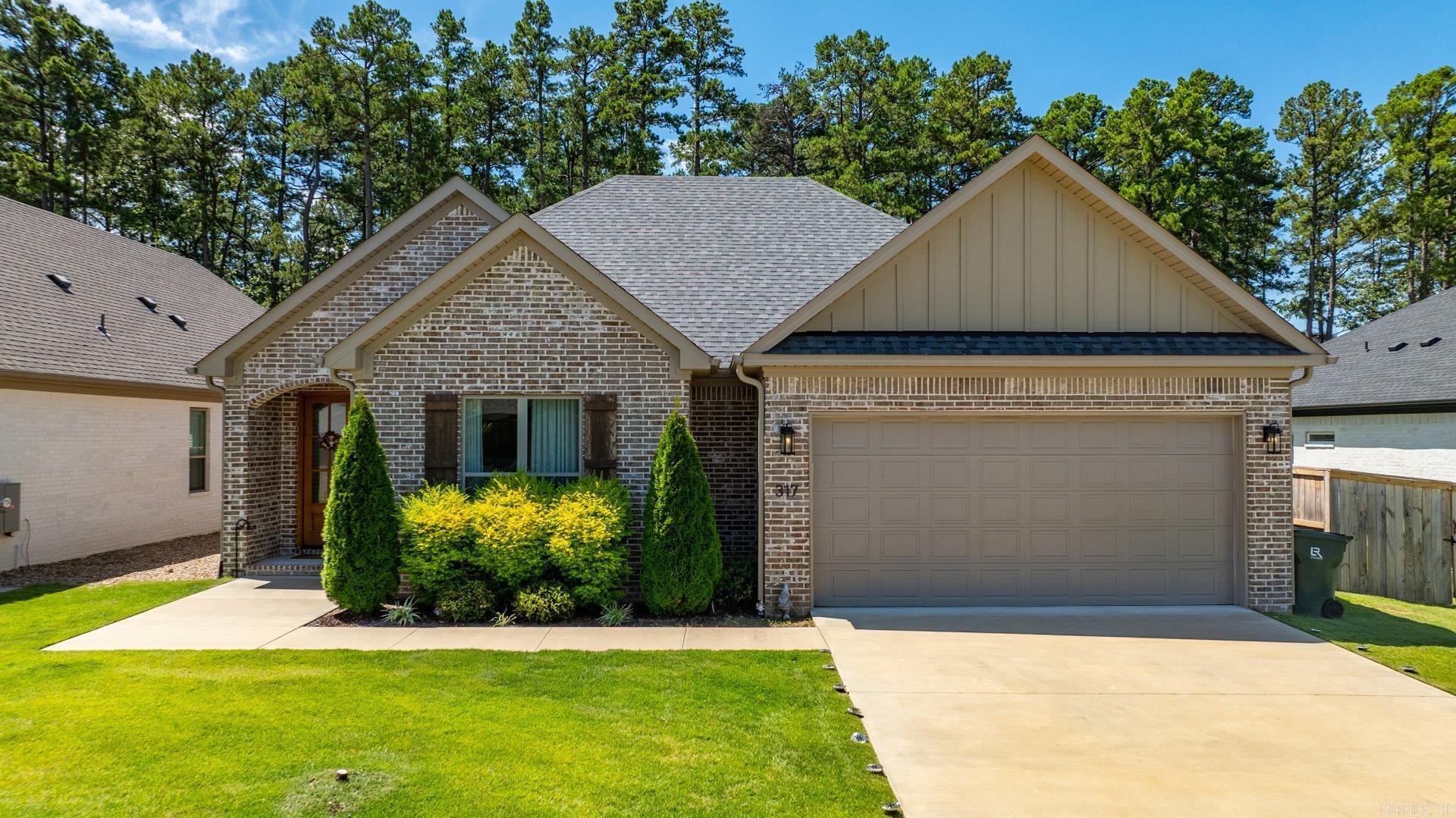 This stunning 4-bedroom home for sale in prestigious West Little Rock showcases a highly coveted floor plan designed for modern living. The contemporary paint color, stylish luxury vinyl flooring and exceptional quality work throughout create a seamless blend of comfort, elegance and functionality. An open spacious living room designed to be the heart of the home, the fireplace serves as focal point, creating a cozy ambiance, making it perfect for relaxation. The gourmet kitchen boasts expansive quartz countertops, a generous island bar, stainless steel appliances, a newly installed vent-out hood, plentiful cabinetry and a walk-in pantry. The primary suite offers a tranquil retreat, featuring large bathroom with freestanding socking tub, an oversized tiled walk-in shower, dual vanities, and spacious closet. The versatile fourth bedroom can easily function as a home office or a formal dinning room. Fully fenced backyard features large covered patio with an outdoor fireplace, perfect for family gathering; Don't miss the opportunity to own this beautifully designed residence! The HOA fee covers yard mowing, home has sprinkler system.