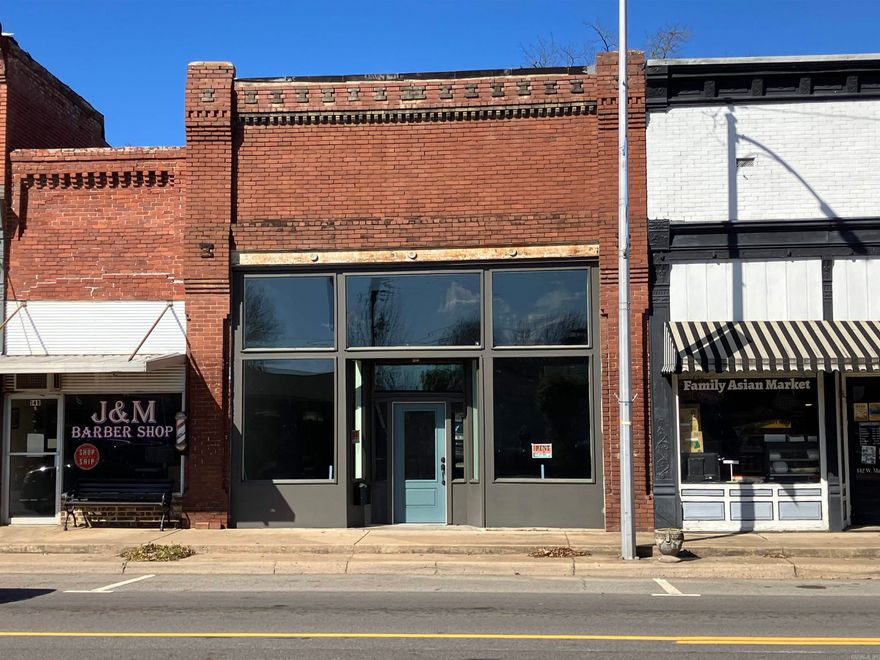 Located in the heart of Historic Downtown, this beautifully preserved Colonial Revival brick building offers a perfect blend of timeless character and modern updates. Built in 1904, the property features an open-concept layout ideal for retail, office, or boutique businesses, with two private rooms/offices in the back for added versatility. Eye-catching oversized metal ceiling tiles and a flat roof with a parapet add to its architectural charm, while recent upgrades ensure a move-in-ready space. Updates include new electrical, new front window display glass for enhanced visibility, an updated restroom, new mini-split HVAC units, fresh paint, and updated lighting. With high visibility and excellent traffic count, this versatile space is perfect for boutiques, professional offices, restaurants, retail shops, or other permitted uses. Don't miss the opportunity to establish your business in a prime downtown location—schedule a tour today!  Property is also available for lease!