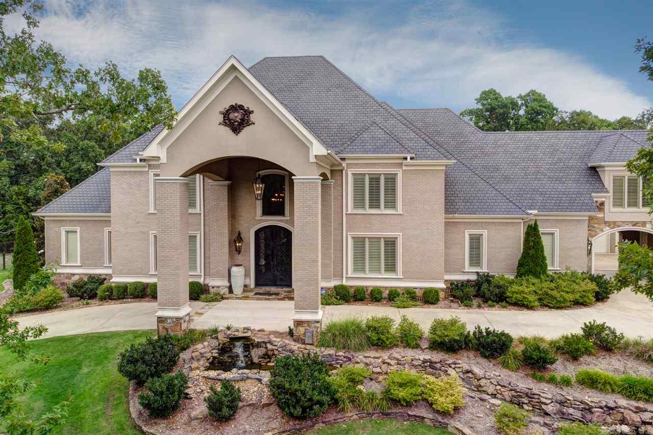 Truly magnificent, this custom Chenal Downs estate home has everything! Soaring floor to ceiling windows in Great Room, stately bar/wine rm, pool room accesses outdoor entertaining area, butler pantry & frml dining. Stunning Master suite w/gorgeous bath & fitness rm, as well as guest suite on main. Huge eat in kitchen w/top of the line appl, 2 work areas, dining & hearth rm. Up has 3 BDRM suites, Office/6th BDRM, Art/Craft Rm, Bonus Rm, Game Rm & true Theater Rm. Pool, hot tub, 3 & 2 car garages. Come See!