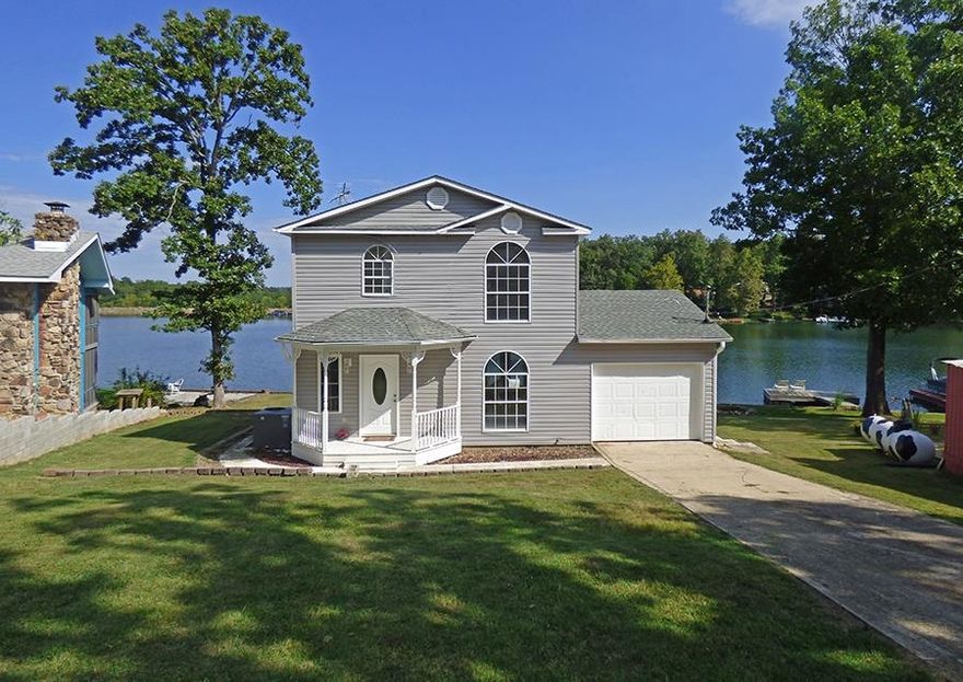 Completely Remodeled House on Lake Sequoyah - Features new flooring; interior paint; fixtures; countertops, and island in the kitchen. There's 2 bedrooms, full and three-quarter baths, vinyl siding, Architectural shingled roof, and garage. This house sits down close to the Lake Sequoyah water frontage and offers gorgeous lake views from the kitchen and master bedroom. Enjoy swimming, fishing, kayaking, and relaxing in the peace and quiet.