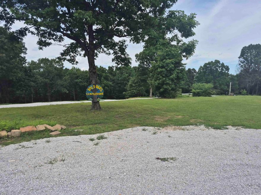 This 4.75 +/- acre property offers an ideal setup for recreational use or potential income, featuring 2 full RV/Camper hookups and 3 established primitive camping sites, with room to add more. Water, Septic and Electricity are already on side, providing convenience and functionality. Scattered fruit trees add a touch of charm to the landscape.  Conveniently located on US Hwy 65, the property offers easy access and is just minutes from the scenic Buffalo National River-making it a prime spot for outdoor enthusiasts, campers, or anyone looking to enjoy the natural beauty of the Ozarks.