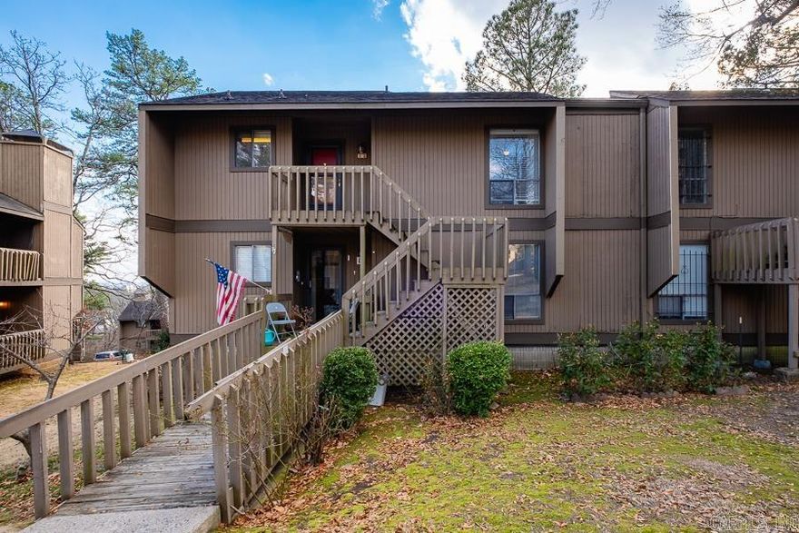 Welcome home to this charming condo in the desirable Forest Hills Condominium Complex!  Step inside to a warm and inviting entrance featuring original parquet flooring that adds character and timeless appeal. The main living space boasts beautiful hardwood floors and a cozy wood-burning fireplace, the perfect spot to relax and unwind.  The galley-style kitchen is both functional and efficient, offering abundant cabinet space for all your storage needs. Whether you're preparing everyday meals or entertaining guests, this kitchen maximizes every inch.  Both bathrooms maintain their original charm, full of personality and ready for your personal touch. The two spacious bedrooms feature newer carpet, creating comfortable retreats at the end of the day.  Enjoy outdoor living with not one, but two private deck spaces, ideal for morning coffee or evening relaxation. One deck even includes a convenient storage closet for added functionality.  With character, comfort, and great outdoor space, this condo offers a wonderful opportunity to own in Forest Hills. Schedule your private showing today!