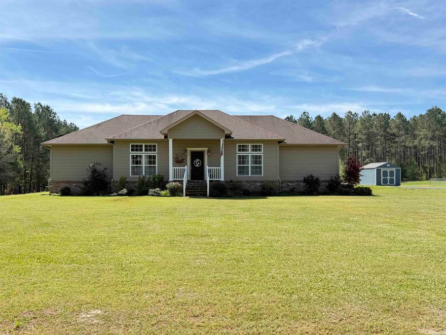 Welcome to your own private retreat! This beautifully maintained 3-bedroom, 2-bath home offers the perfect blend of comfort, space, and peaceful country living—all nestled on four gorgeous acres.  Step inside to find a thoughtfully cared-for interior featuring a spacious layout and inviting atmosphere. The heart of the home is the stunning kitchen, complete with a beautiful island, ample cabinetry, and plenty of room for gathering and entertaining. The primary suite is a true escape, showcasing an updated shower, relaxing garden tub, and generous space to unwind. All bedrooms are well-sized with plenty of storage throughout the home to keep everything organized and clutter-free. Outdoors, this property truly shines. Enjoy your own backyard oasis with a pool house that includes an additional shower—perfect for guests or summer entertaining. A large shop with a dedicated workroom provides endless possibilities for hobbies, storage, or projects. The additional concrete areas and thoughtfully designed landscaping create multiple spaces for relaxing, entertaining, or simply enjoying the peaceful surroundings.