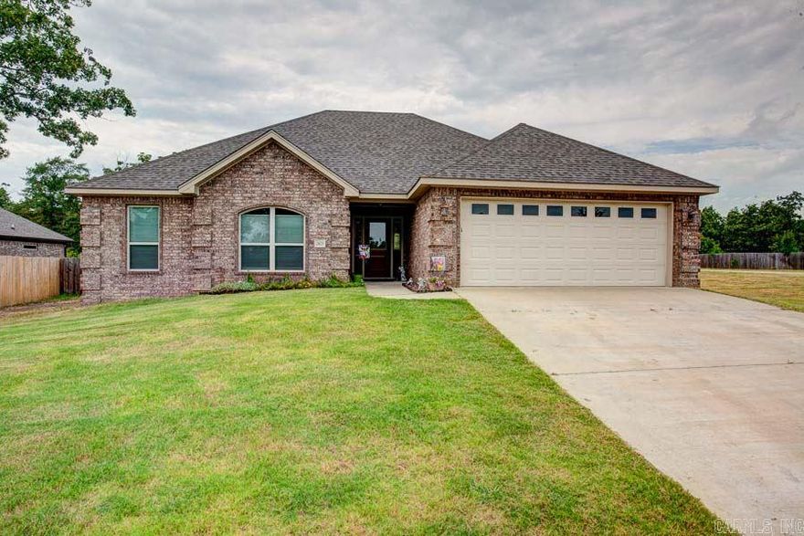 Beautiful 3BD/2BA home located on a corner lot in the exclusive Stone Hill addition. Home features include: Split open floor plan, custom hickory wood cabinets, stainless steel appliances, Corian countertops, flat finish stained concrete floors throughout except bedrooms, tray ceiling in living room, gas start fireplace, and large oversized fully fenced yard with garden area. Must see!!!