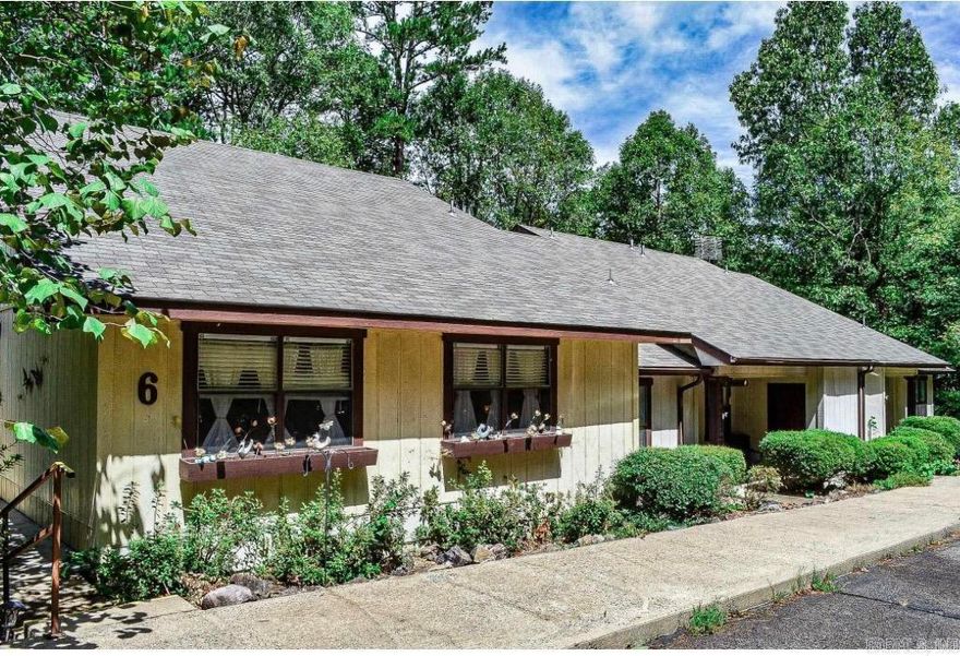 Beautifully maintained and move-in ready, this 2 bed, 2 bath condo in Hot Springs Village offers comfort, convenience, and investment potential. The open living, dining, and kitchen layout creates an inviting space for relaxing or entertaining, while a cozy breakfast nook is perfect for morning coffee with peaceful wooded views. The split-bedroom floor plan provides privacy, with two spacious bedrooms and bathrooms ideal for guests, full-time living, or rental flexibility. Large windows bring in natural light throughout, and the private deck offers a quiet place to enjoy the surrounding nature. Recent updates include a new roof and a newly rebuilt and serviced air conditioning unit for low-maintenance living. Refrigerator conveys. Located just 2 minutes from the Calella Road area with dining, gas, and essentials nearby. With continued growth in Hot Springs Village, this property is a great option for investors or homeowners and qualifies for Rural Development. Move-in ready opportunities like this go quickly—don’t miss it!