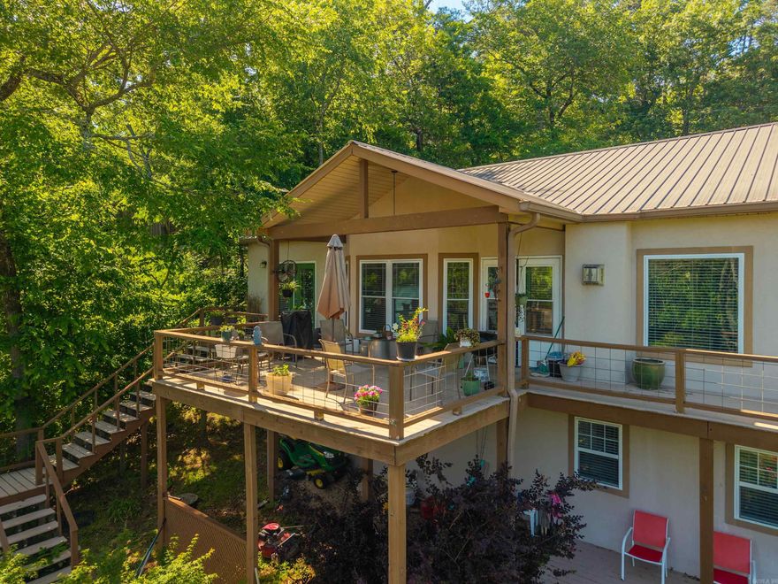 This lake house has it all, welcome to 415 Kirschwwod Drive! Spacious 3 bedroom, 3 bath home featuring a versatile bonus room downstairs, perfect for a game room, office, or guest space. 2 car garage with a brand new driveway, separate laundry room, large walk in closet and tons of storage space downstairs! Nestled in a year-round deep-water cove with a private boat dock, this property offers easy access and exceptional waterfront living. The covered back deck offers views of the main channel and perfect for entertaining! Located right down the street from Treasure Isle boat ramp and out of city limits, this could be a lucrative short term rental!