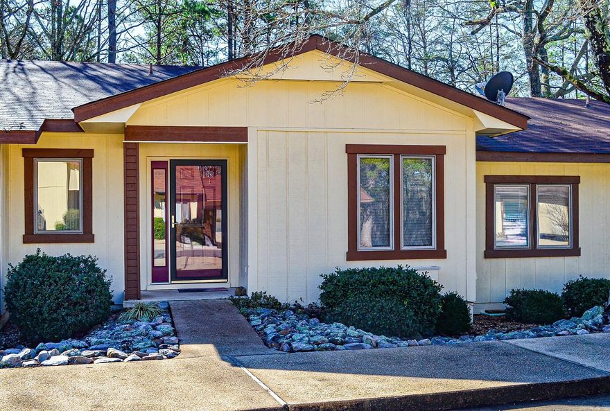 All the updating has been done......ready for you to simply move in and enjoy Hot Springs Village. New roof completed March 2024,laminate flooring, quartz counters, fresh paint and upscale 1.5 bath. The Jack & Jill bath offers a tub/shower. Overlook common property woods from the roomy deck. Additional deck storage closet. Townhome monthly fee of $109.00 covers weekly trash pick-up and yard maintenance. Hot Springs Village Property Owners Association has a new member buy-in fee of $1500.00 due and collected at closing.