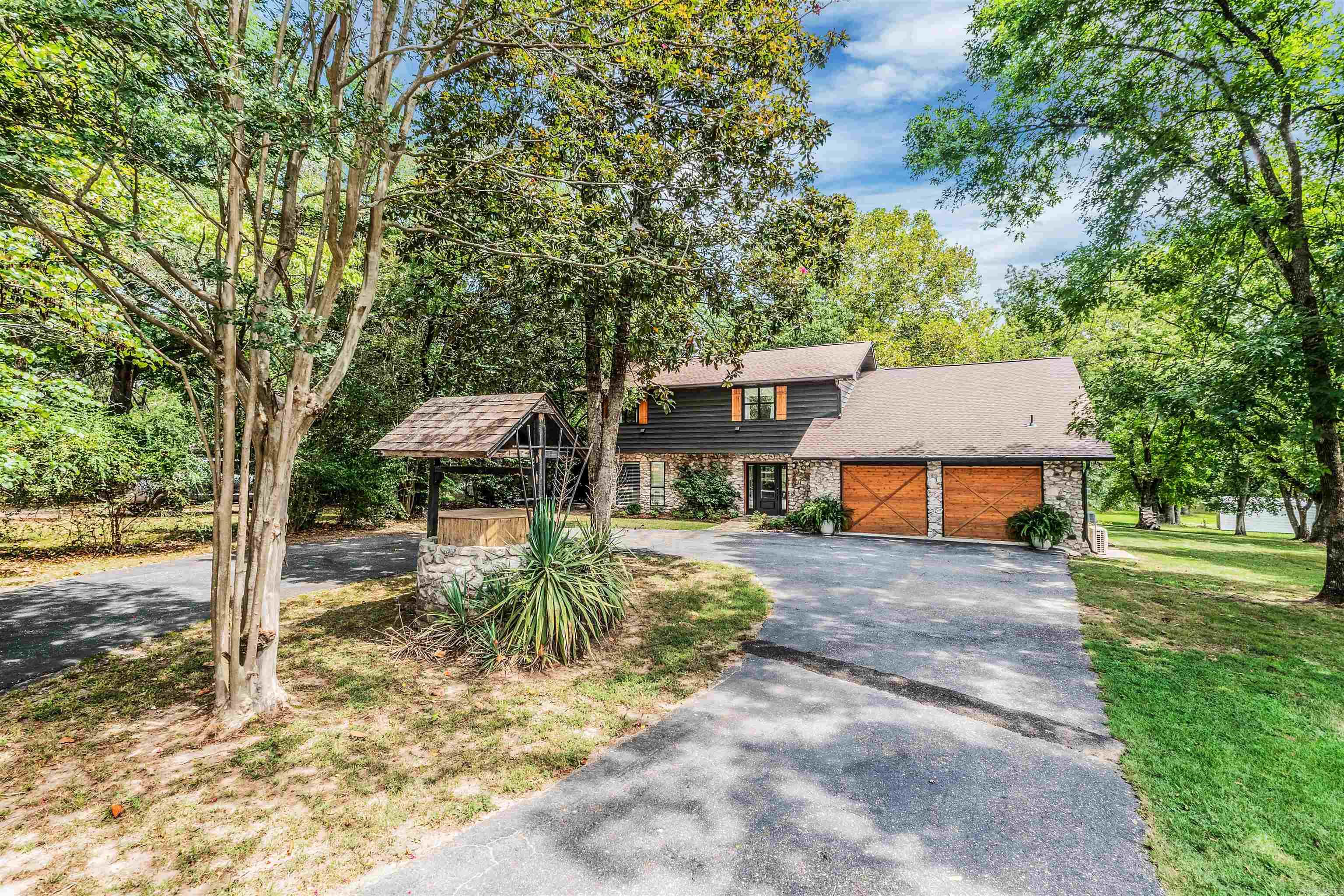 LAKE HAMILTON | RENOVATED | RARE FLAT 1.5± ACRES | TWO-SLIP DOCK Lake life, leveled up. Fully renovated, this 5 bedroom, 3 bath + bonus room waterfront retreat sits on a rare, mostly flat 1.5± acre lot with a gentle walk to the shoreline. Host the whole crew on the expansive covered patio, then head to your covered two-slip dock for sunset cruises and weekend fun. Inside: a bright, open feel, fresh designer finishes, updated kitchen and baths, and a flexible bonus room for a game/media/bunk space or office. Outside: mature shade trees, a huge usable yard, fire-pit area, and easy water accessāexactly what buyers hope to find on Lake Hamilton but almost never do. Why this one wins: turnkey renovation, real space to spread out, coveted flat waterfront, and a protected dock setupāminutes to dining, shopping, and entertainment in Hot Springs.