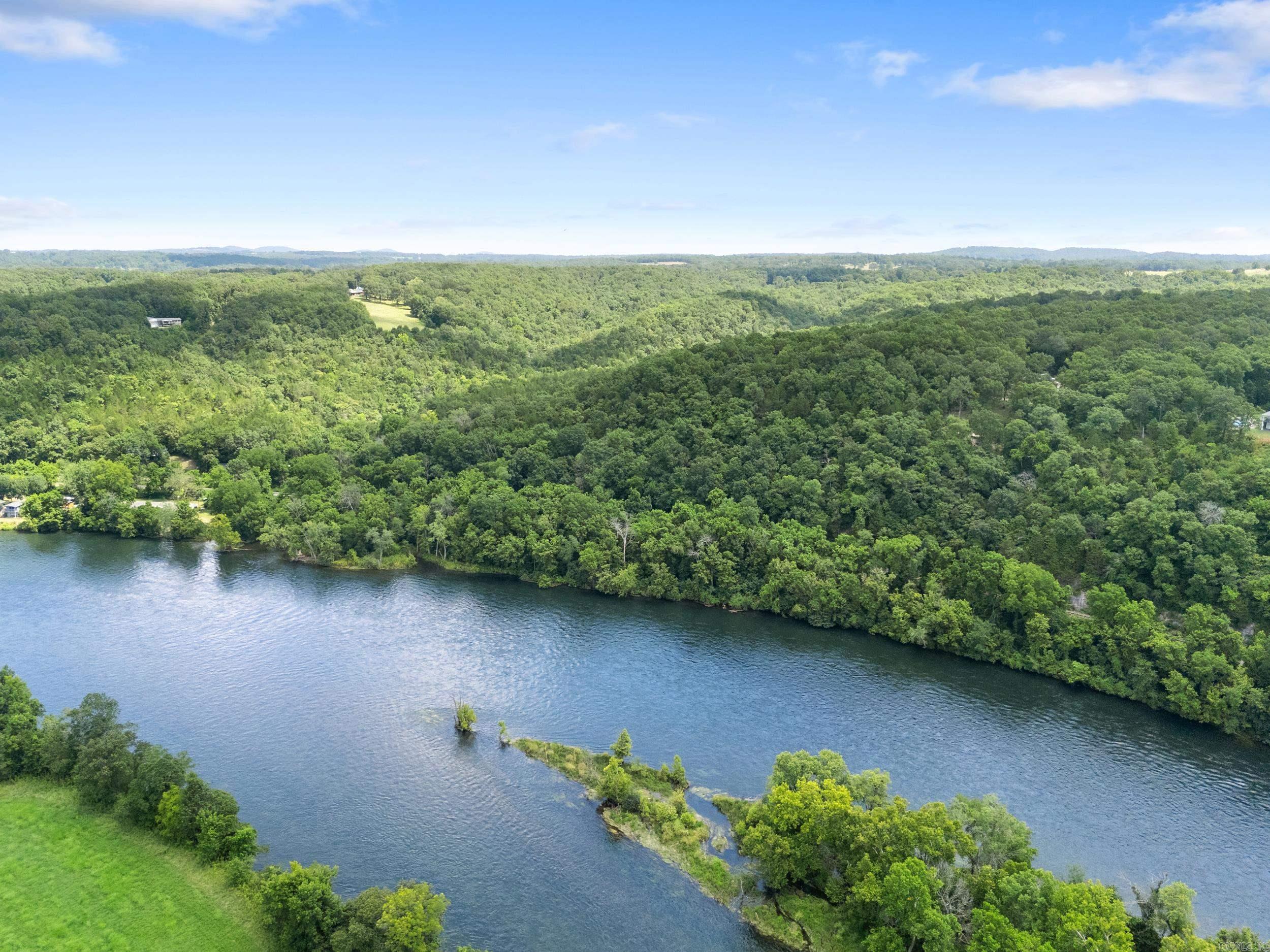 Discover the ultimate outdoor retreat on this 167 acre m/l property in the Ozarks with direct access to the White River. Featuring three caves, waterfalls, multiple year-round creeks, and an extensive network of trails, this land offers endless recreational possibilitiesāfrom hiking and ATV riding to exploring the natural wonders on site. Enjoy panoramic bluff-side views and prime hunting opportunities in a secluded yet accessible location near Rim Shoals and local hiking trails. A home and shop are included, offering a great opportunity for renovation into a cozy hunting cabin, vacation getaway, or full-time residence. With electric, well and septic already in place, the property is ready for your vision. Whether youāre an outdoor enthusiast, hunter, or investor looking for unique acreage with water features and river access, this property delivers unmatched potential in a breathtaking natural setting. Donāt miss this rare chance to own a slice of Arkansas wilderness.