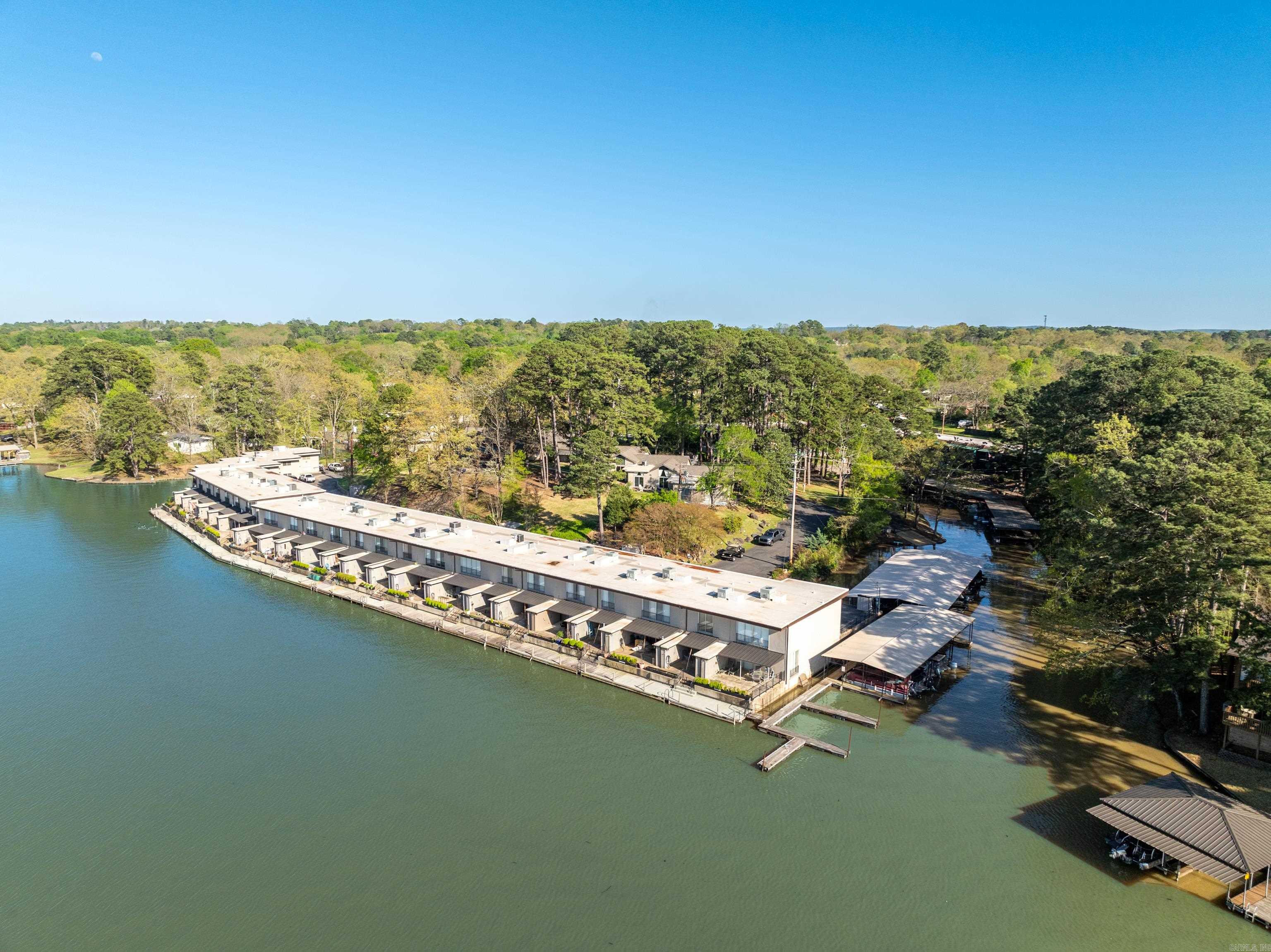 DONT MISS THIS ONE! LAKE ACESS CONDO! NO SHORTTRM RENTALS! Moonlight Bay Condo is a gated community, Meticoulously Maitained ,Boat dock avaiability, Single storty ( No stairs) Covered Parking. Stunning 2-bedroom 2-Bathroom - master suites. This condo provides privacy and comfort, and a peaceful enviroment . Open floor plan, vaulted ceiling. Remodeled. Landscaped patio and separate private porch. Recent upgrades include a new HVAC and new roof. Located near Lake Hamilton, minutes away from Historic Hot Springs and close to Oaklawn Racetrack and Casino. Don't miss out on this exceptional opportunity to own a piece of paradise!